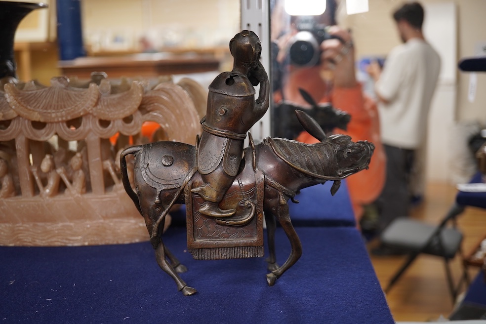 A Japanese bronze dragon vase, Chinese bronze immortal on donkey, and soapstone dragon boat carving, bronze vase 24cm high. Condition - good